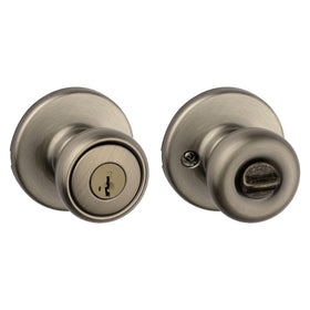 Kwikset Tylo entry door knob in antique brass with secure keyed entry for exterior doors.