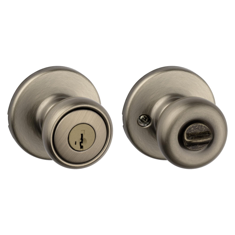 Kwikset Tylo entry door knob in antique brass with secure keyed entry for exterior doors.
