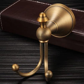 KWQKEM brushed gold finish towel hook closeup highlighting durable brass construction.