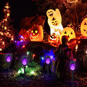 KYEKIO outdoor lights showcase a flickering purple flame for Halloween decor