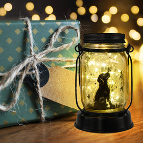 Kyoryuger dog solar lantern emits a warm glow for garden ambiance