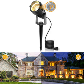 L LOHAS LED landscape spotlight with dusk-to-dawn sensor illuminating the garden path.