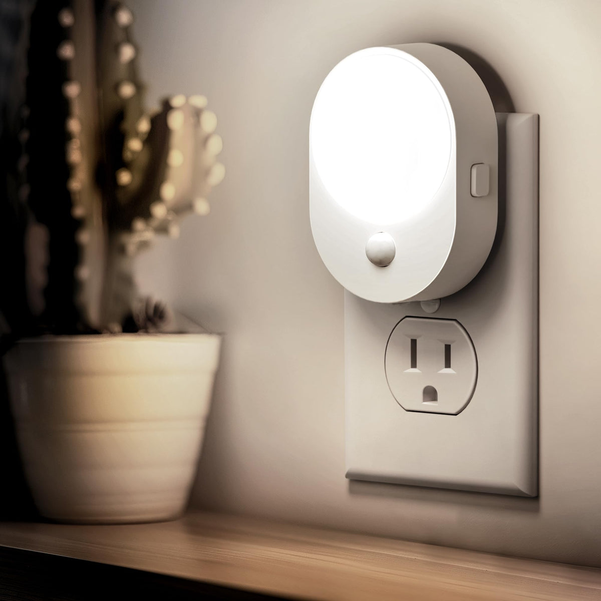 L LOHAS LED motion sensor night light mounted on wall for gentle, energy-saving illumination.