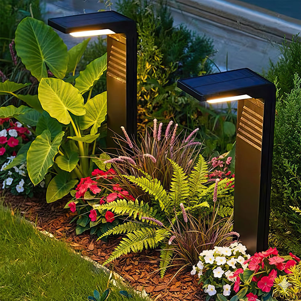 Lampat 6-pack solar pathway lights illuminate dusk glow along a garden path.