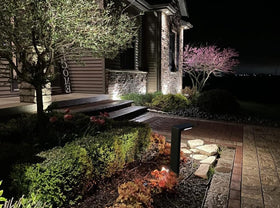 Lampat garden and driveway lighting adds ambience and practical illumination after sunset.
