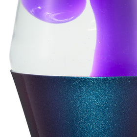 Lava Original Lamp in a cozy room on a coffee table.