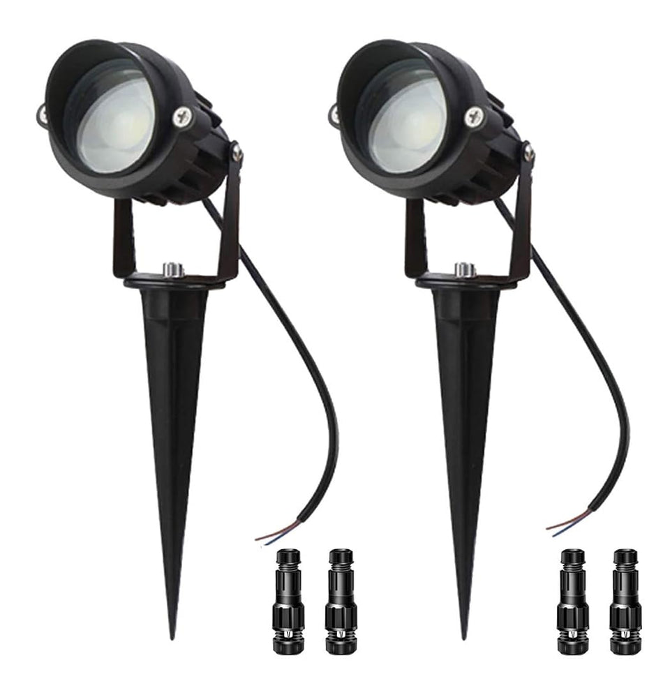 LAVAED wall wash spotlight delivering warm 3000K illumination along a modern exterior wall.