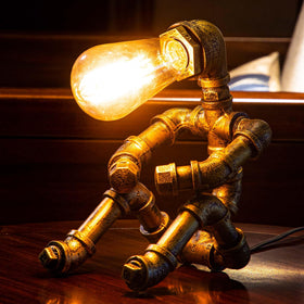 LCYY.TG industrial desk lamp with iron piping and handcrafted detailing.