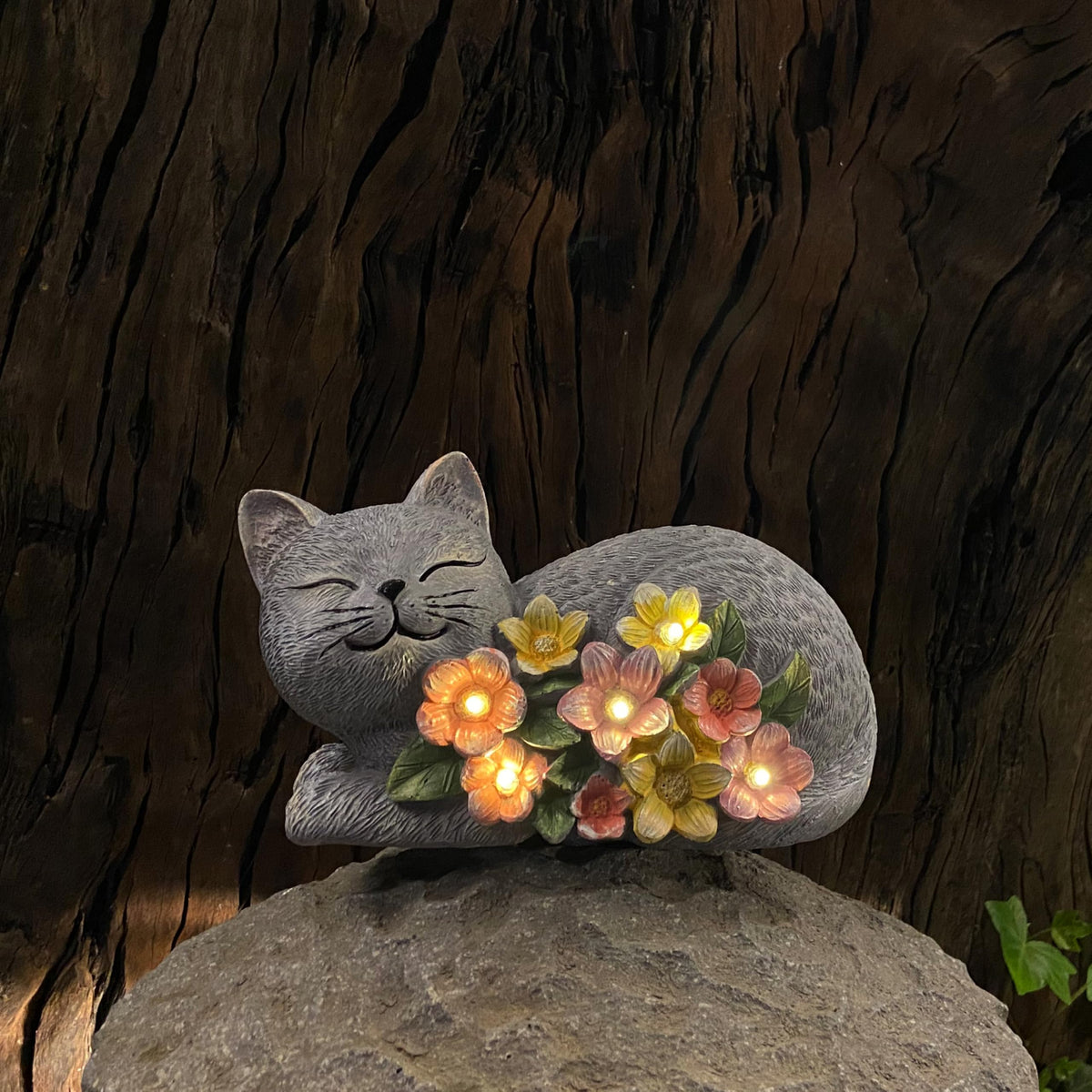 LEAESMHR Cat statue charges in sun for nighttime glow.