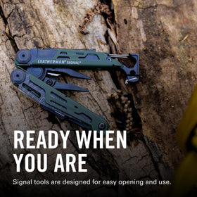 Leatherman Signal saw closeup ready to cut wood during camping.