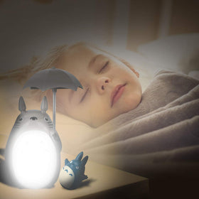 Side view of Lenporl Totoro lamp casting soft light