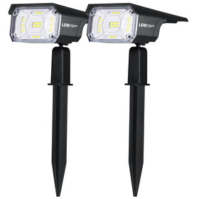 LEREKAM solar spotlights illuminate a tree at night for enhanced curb appeal.