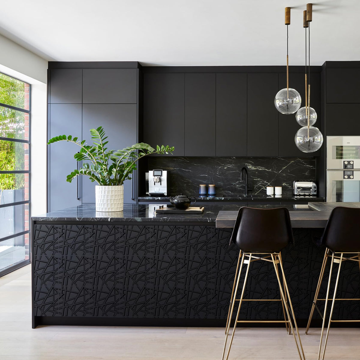 LEVOWAY black textured panels create a bold accent behind a sofa.