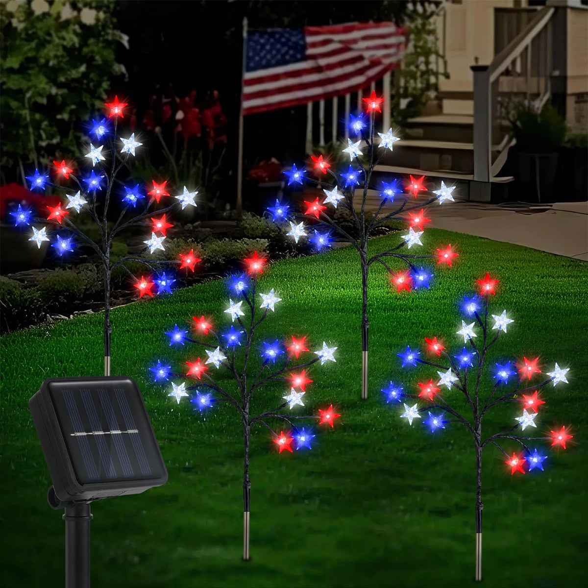 Lewondr 4th of July solar star lights illuminate a garden path with red, blue, and white stars