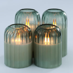 Lezonic glass flameless candles with remote sit on a table for cozy autumn ambiance