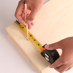 Lichamp tape measure in use for furniture project planning.