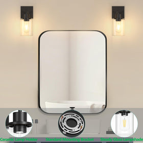 Licperron upward lighting from black vanity sconce above mirror.