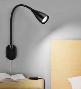 LiFMIRA wall-mounted bedside light with USB port for convenient device charging while reading.