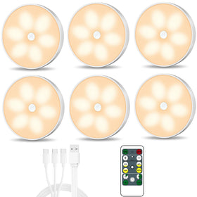 Lightbiz warm-color LED puck light with motion sensor brightens a closet.