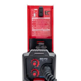 Lincoln Electric 90i FC protected by metal case in rugged environment.