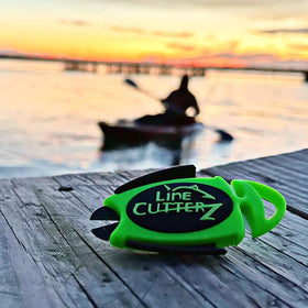 LINE CUTTERZ green clip-on tool attached to belt for quick access on deck