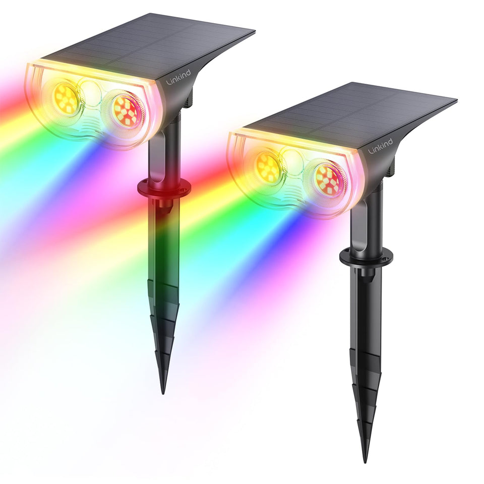 Linkind StarRay RGB solar spotlight lighting the front yard with color-changing options for festive evenings.