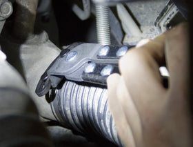 Lisle offset boot clamp plier gripping ear-type clamps in tight spots