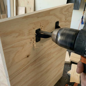 Litepak cabinet door pull in black, adds modern touch to furniture.