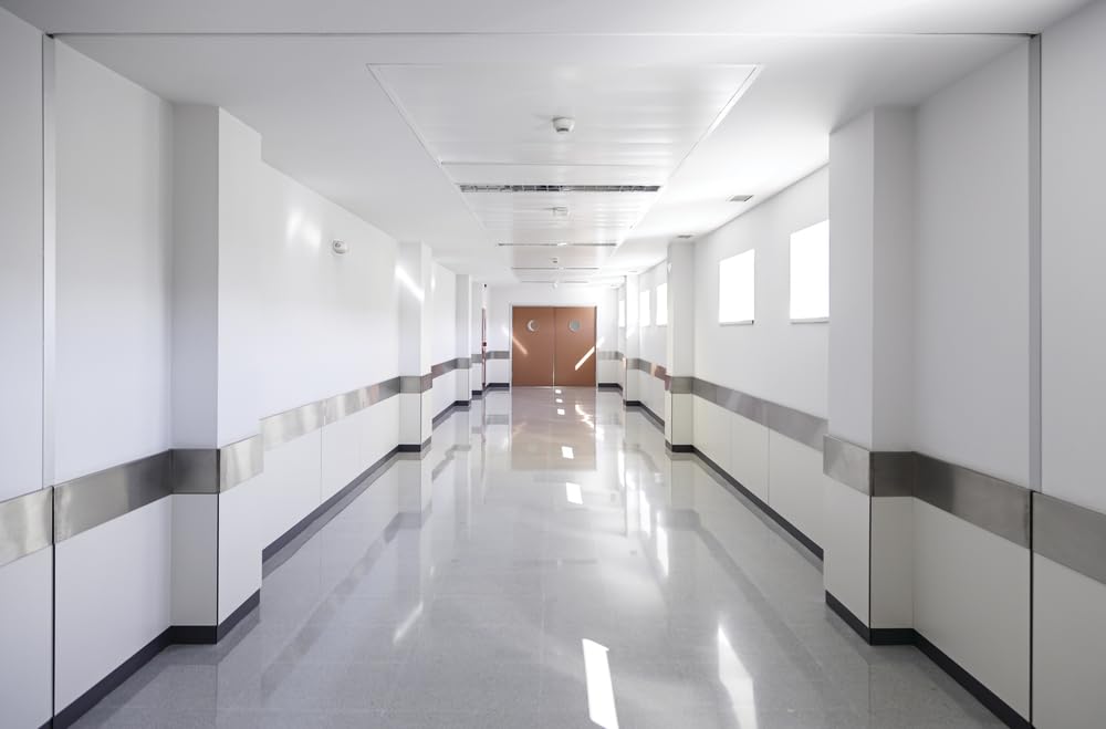 Compact profile Lithonia Quantum Emergency Light fits ceilings or walls in commercial spaces.
