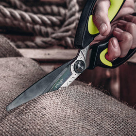 LIVINGO Heavy Duty Scissors cutting plastics and fabrics with controlled precision.