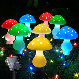 LiyuanQ solar mushroom lights create a whimsical yard display at night