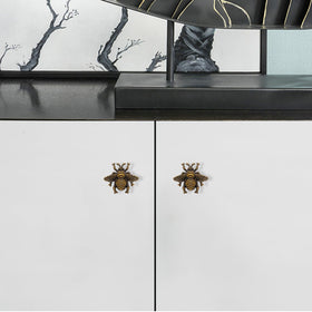 Bee design ornament on dresser for whimsical decor