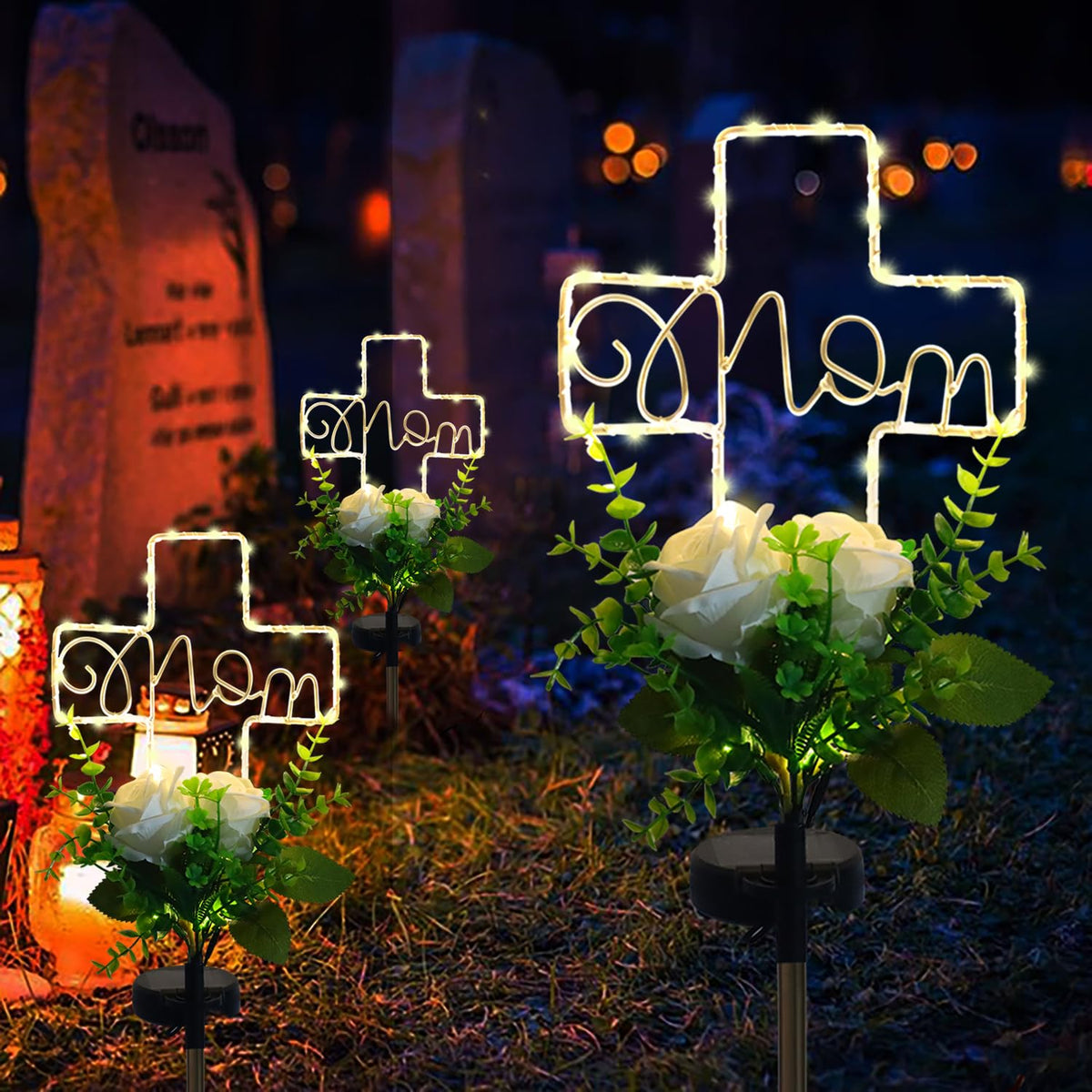 Lmtocs solar cross memorial light illuminating the headstone all season.