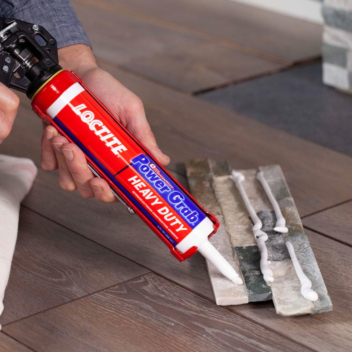 Loctite Power Grab Express is being applied with a caulking gun for professional finishes