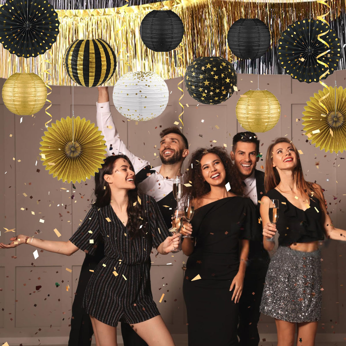 LOMOSO black and gold lanterns add depth to a party setting.