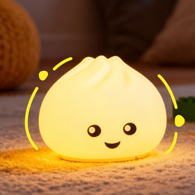 Look at Me Dumpling Squishy Night Light emits a soft glow for a cozy nursery.