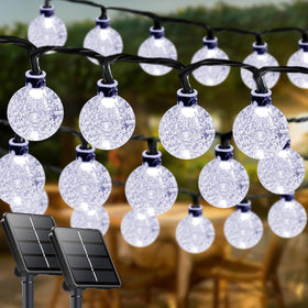 LORRYTE White 2-Pack crystal globe outdoor lights brighten patios with solar-powered convenience.
