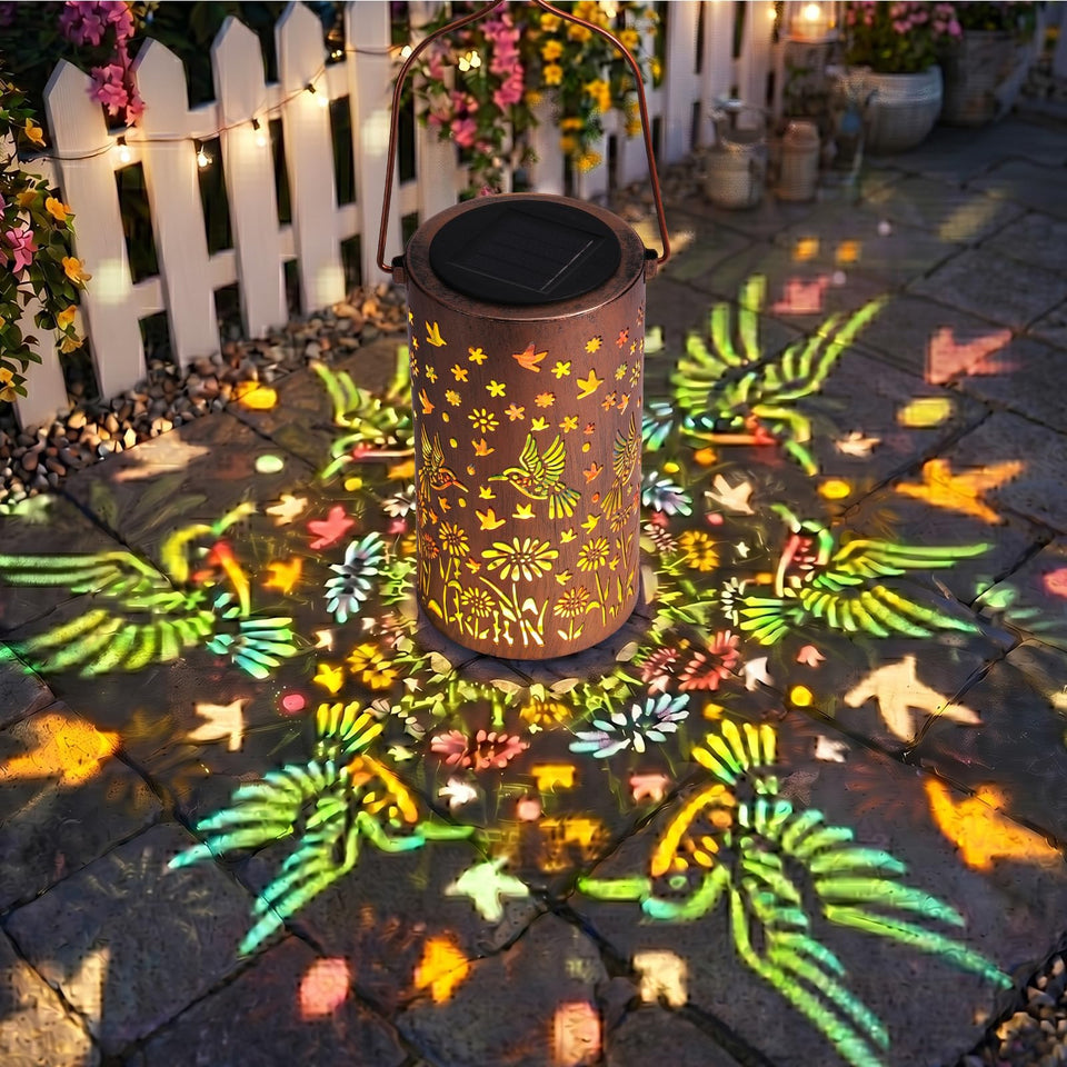 LOVERUIS solar lantern featuring a hummingbird cutout lights the garden at dusk