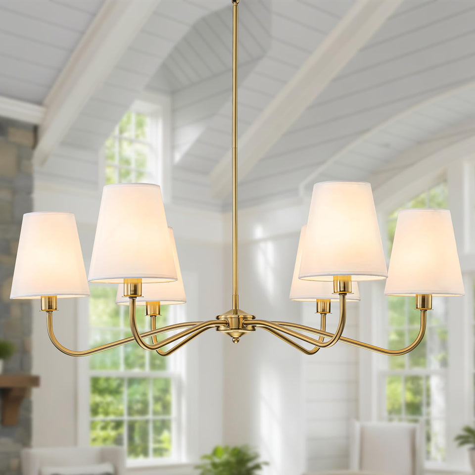 LOZOHOM brass gold chandelier with white fabric shade over dining table for warm ambience.