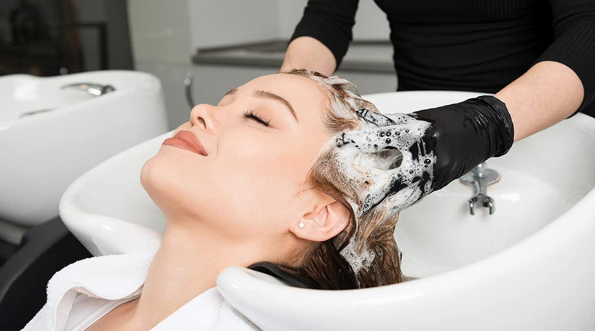 LukLoy shampoo kit in a salon sink demonstrates easy replacement and maintenance