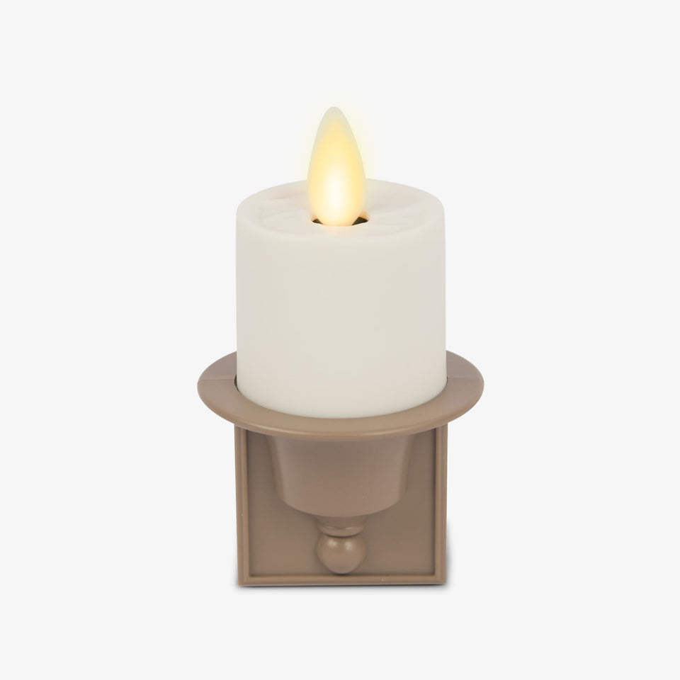 Luminara flameless candle night light with dusk-to-dawn sensor for automatic illumination.