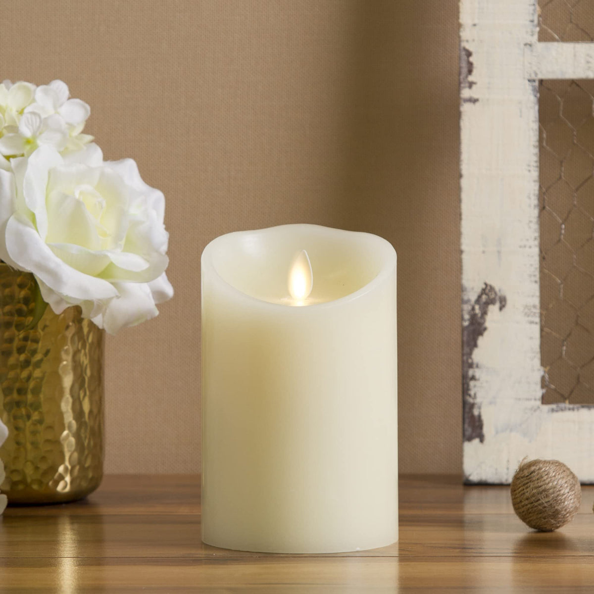 Luminara flameless ivory pillar candle with moving flame for safe, realistic ambiance.