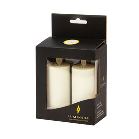 Luminara ivory votives fit small centerpieces and shelves.