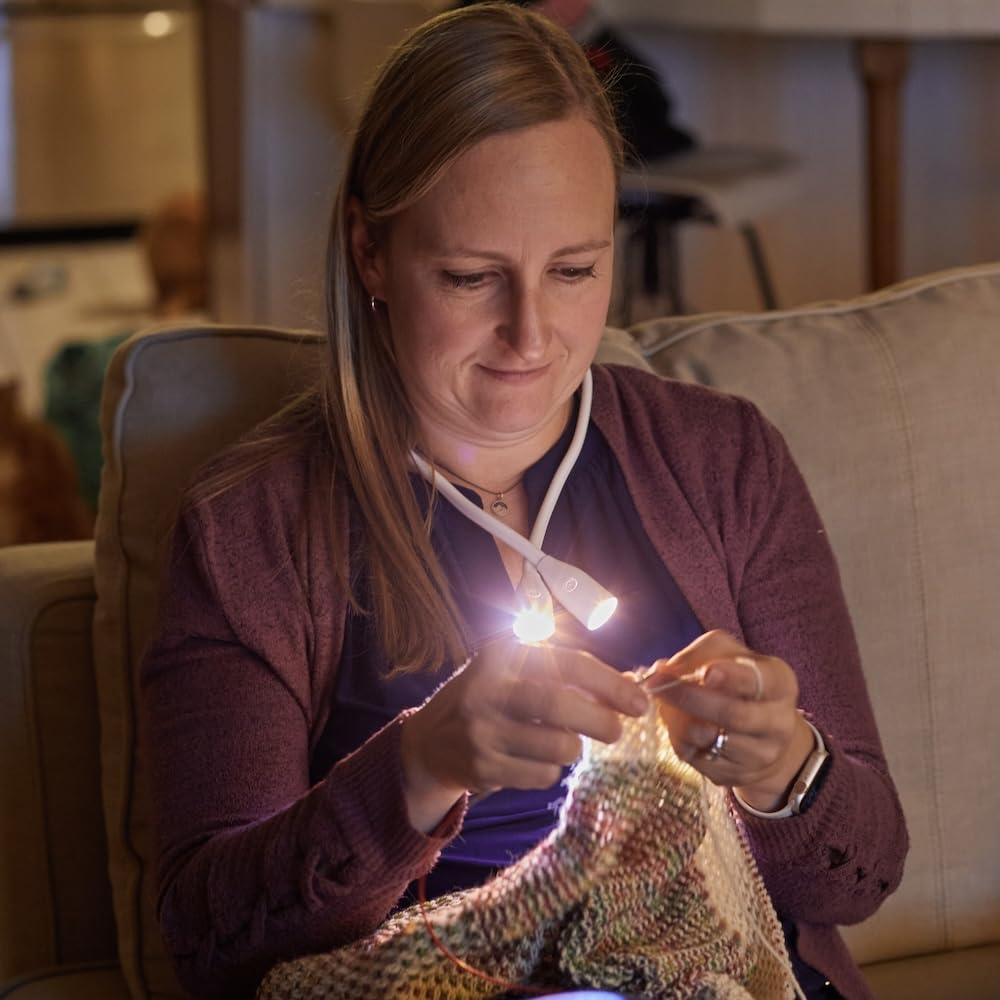 Lumos Knitting Light around the neck is travel-ready for planes, trains, and cars.