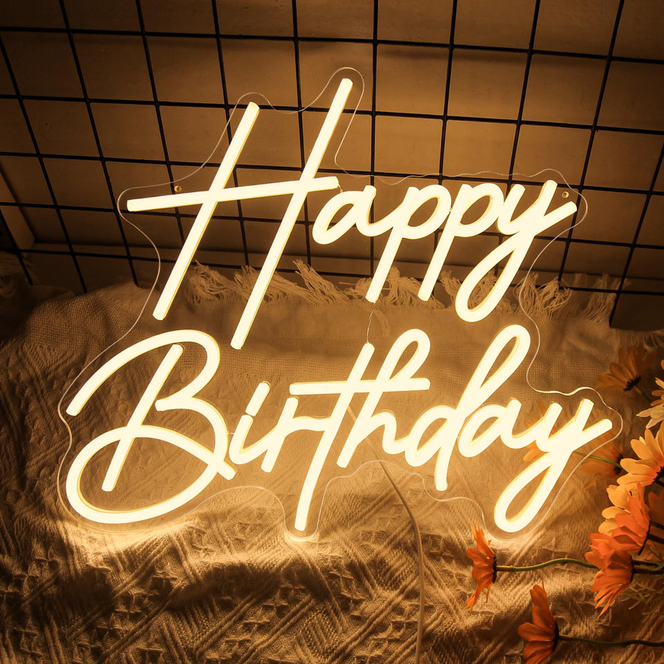 Lurevia Happy Birthday sign on wall glowing for party ambiance.