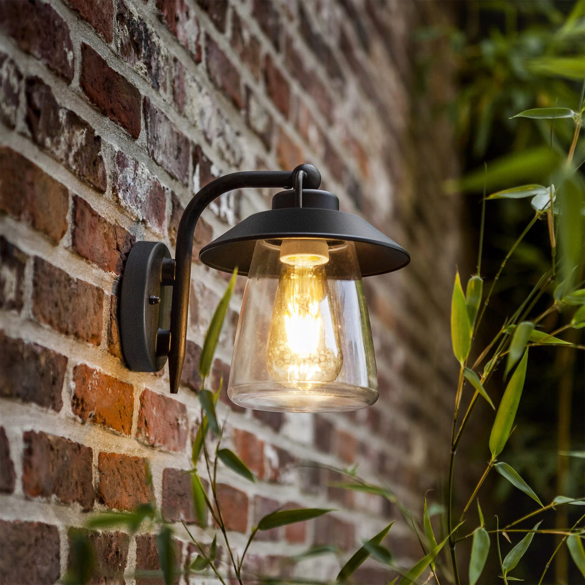 LUTEC outdoor wall lantern with matte black finish illuminating the porch for curb appeal