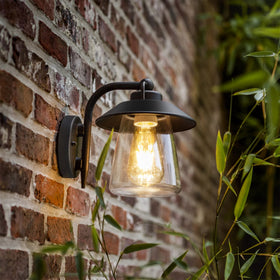LUTEC outdoor wall lantern with matte black finish illuminating the porch for curb appeal