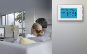 Lux TX9600TS touchscreen display glows, making temperature settings easy to read.