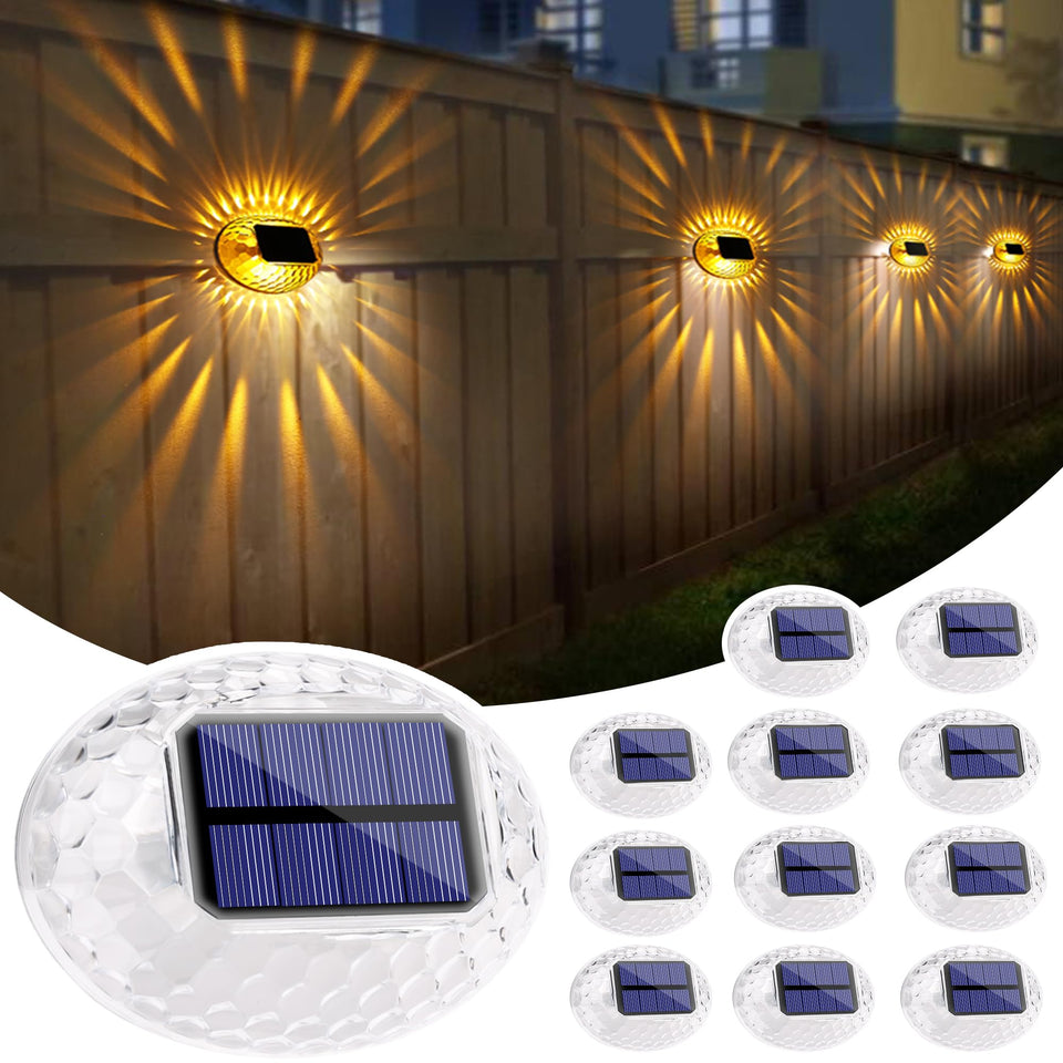 LYHOPE solar fence light pack illuminating a wood deck with warm yellow glow