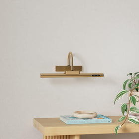 LYTARA gold cordless light with side bracket demonstrates adjustable mounting angle.